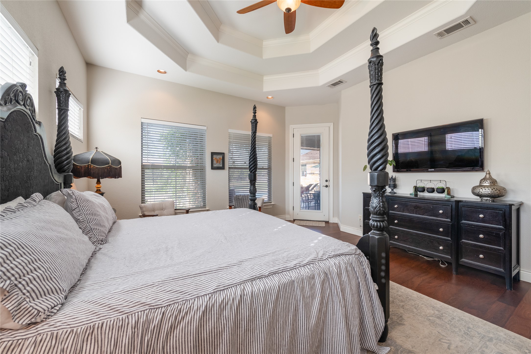 120 Layton Way Georgetown, TX 78633 - Photo 18 of 40 a bedroom with a bed and a flat tv screen