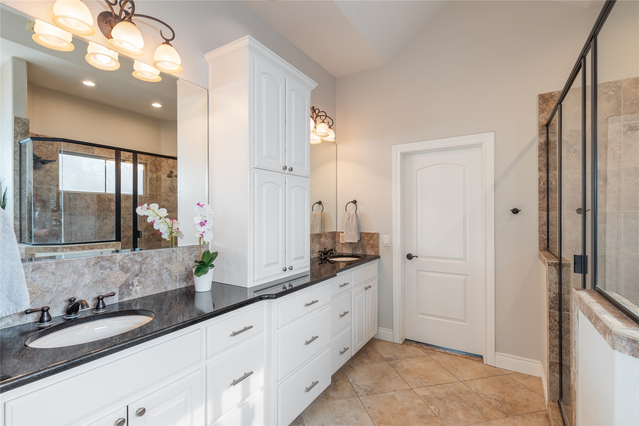 120 Layton Way Georgetown, TX 78633 - Photo 19 of 40 a spacious bathroom with a double vanity sink a mirror and shower