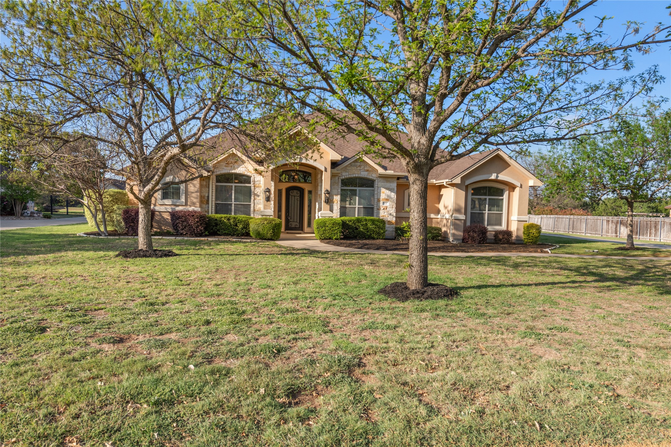 120 Layton Way Georgetown, TX 78633 - Photo 2 of 40 a front view of a house with a garden