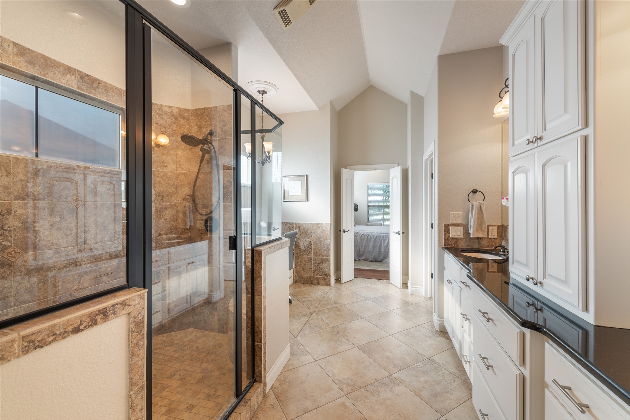 120 Layton Way Georgetown, TX 78633 - Photo 21 of 40 a large white bathroom with a granite countertop sink and a mirror