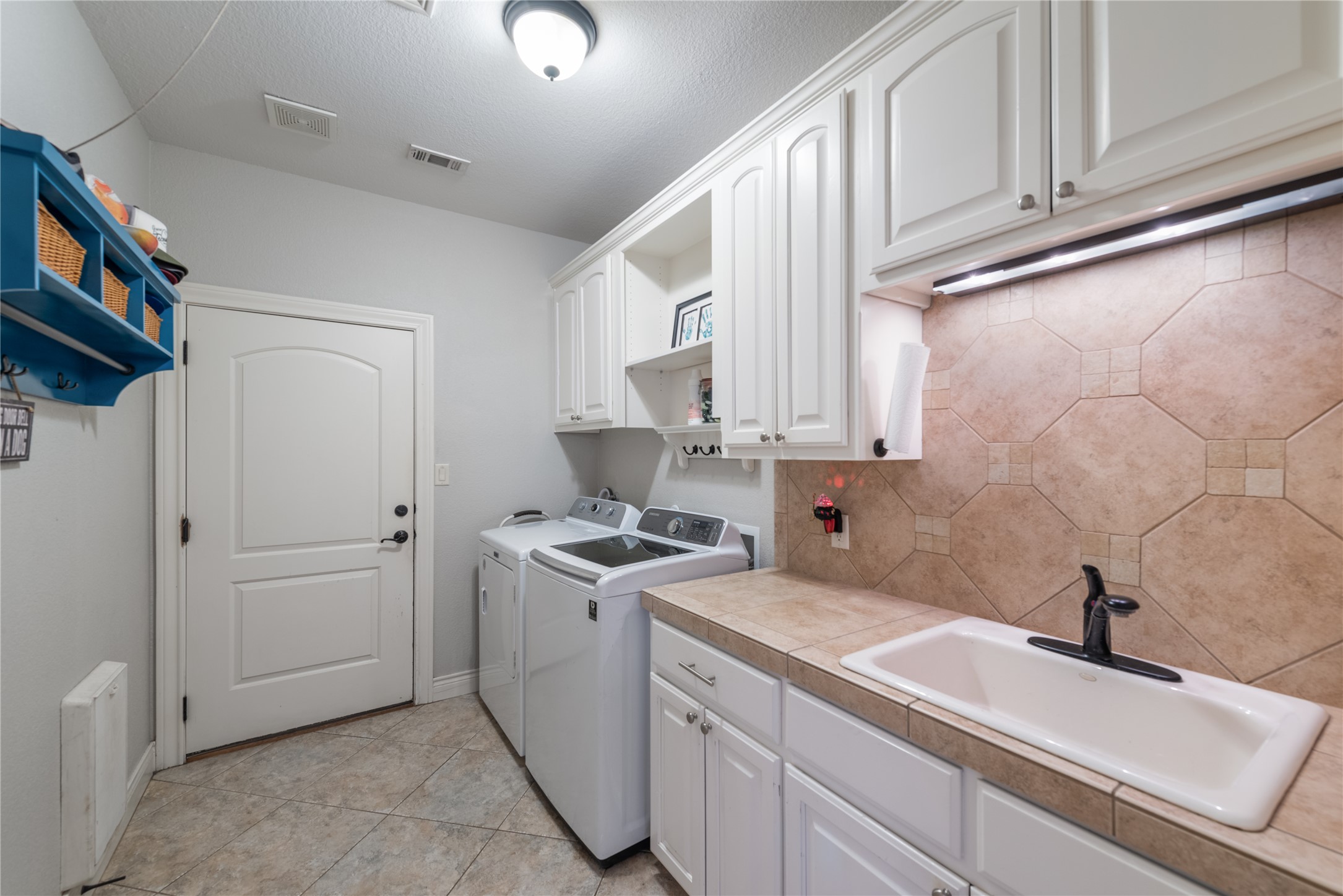 120 Layton Way Georgetown, TX 78633 - Photo 22 of 40 a kitchen with a sink cabinets and appliances