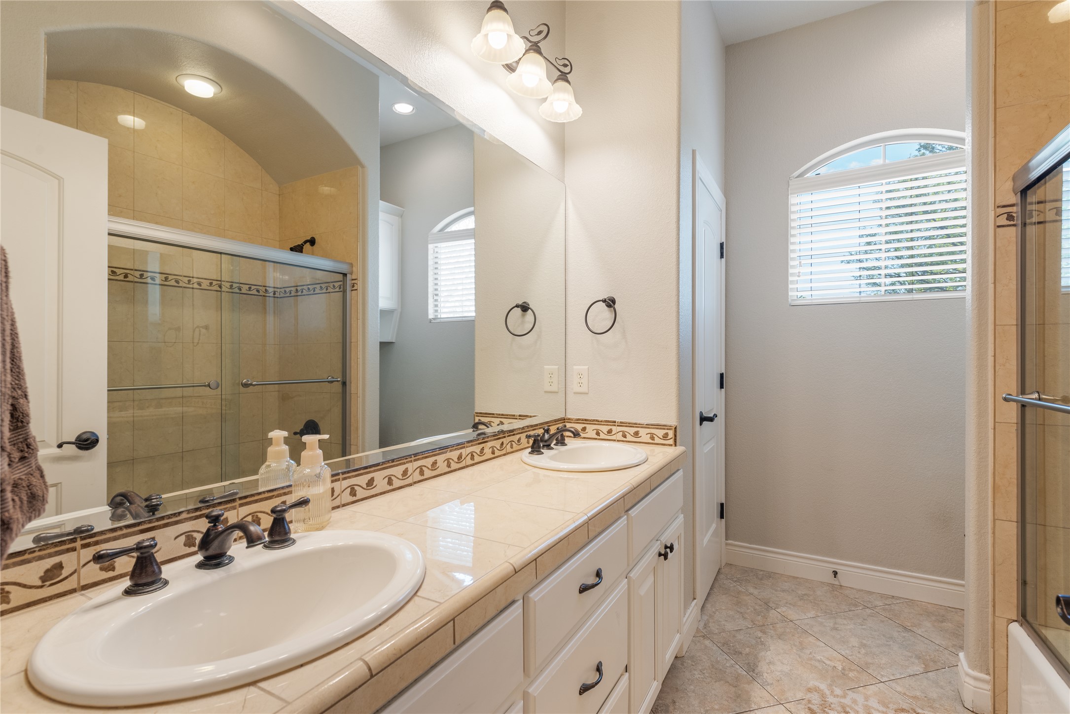 120 Layton Way Georgetown, TX 78633 - Photo 24 of 40 a bathroom with a double vanity sink mirror and double