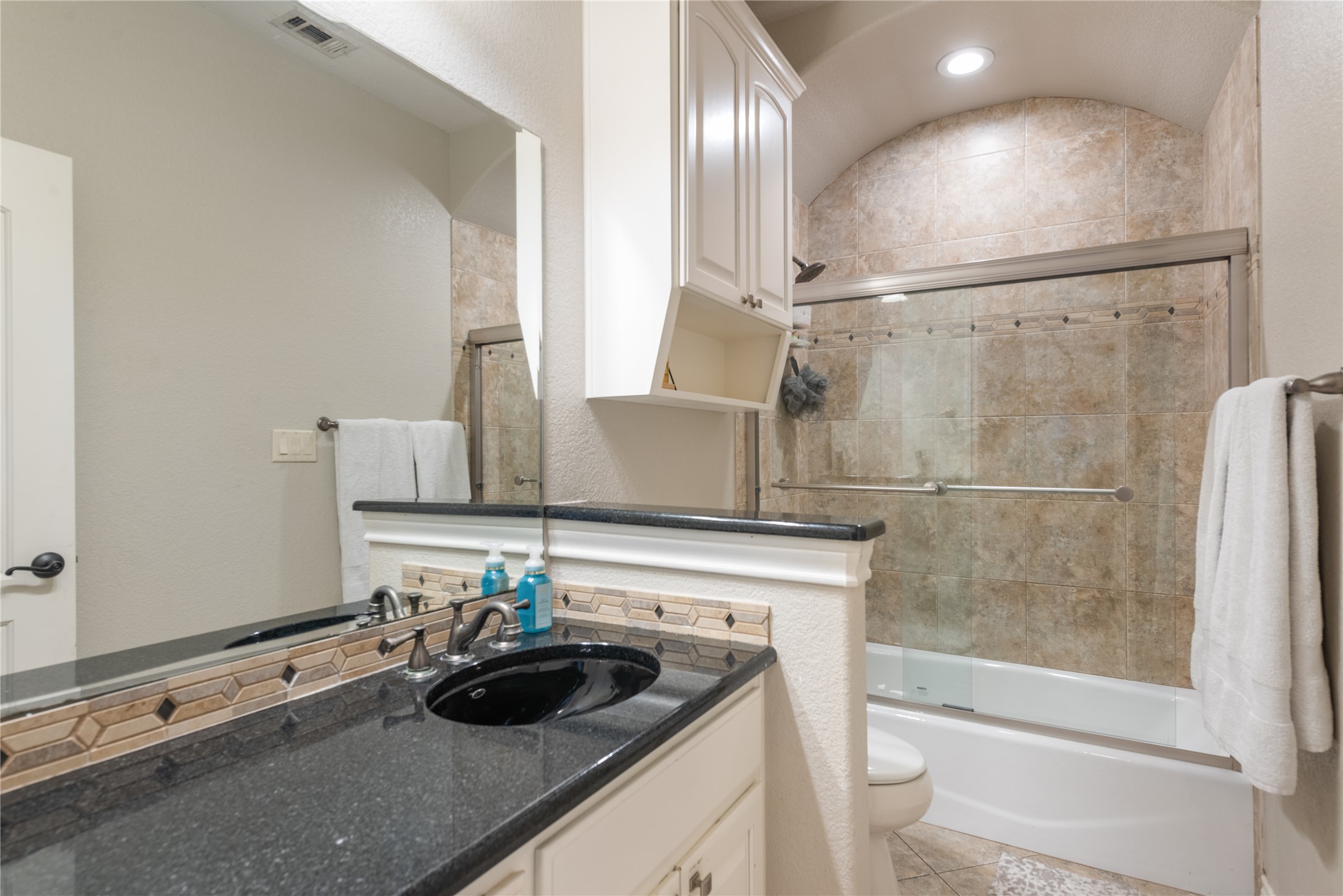 120 Layton Way Georgetown, TX 78633 - Photo 26 of 40 a bathroom with a sink and a mirror
