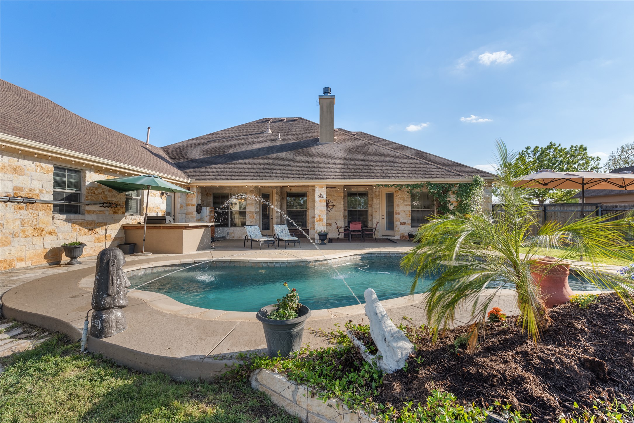 120 Layton Way Georgetown, TX 78633 - Photo 32 of 40 a view of a patio with table and chairs potted plants