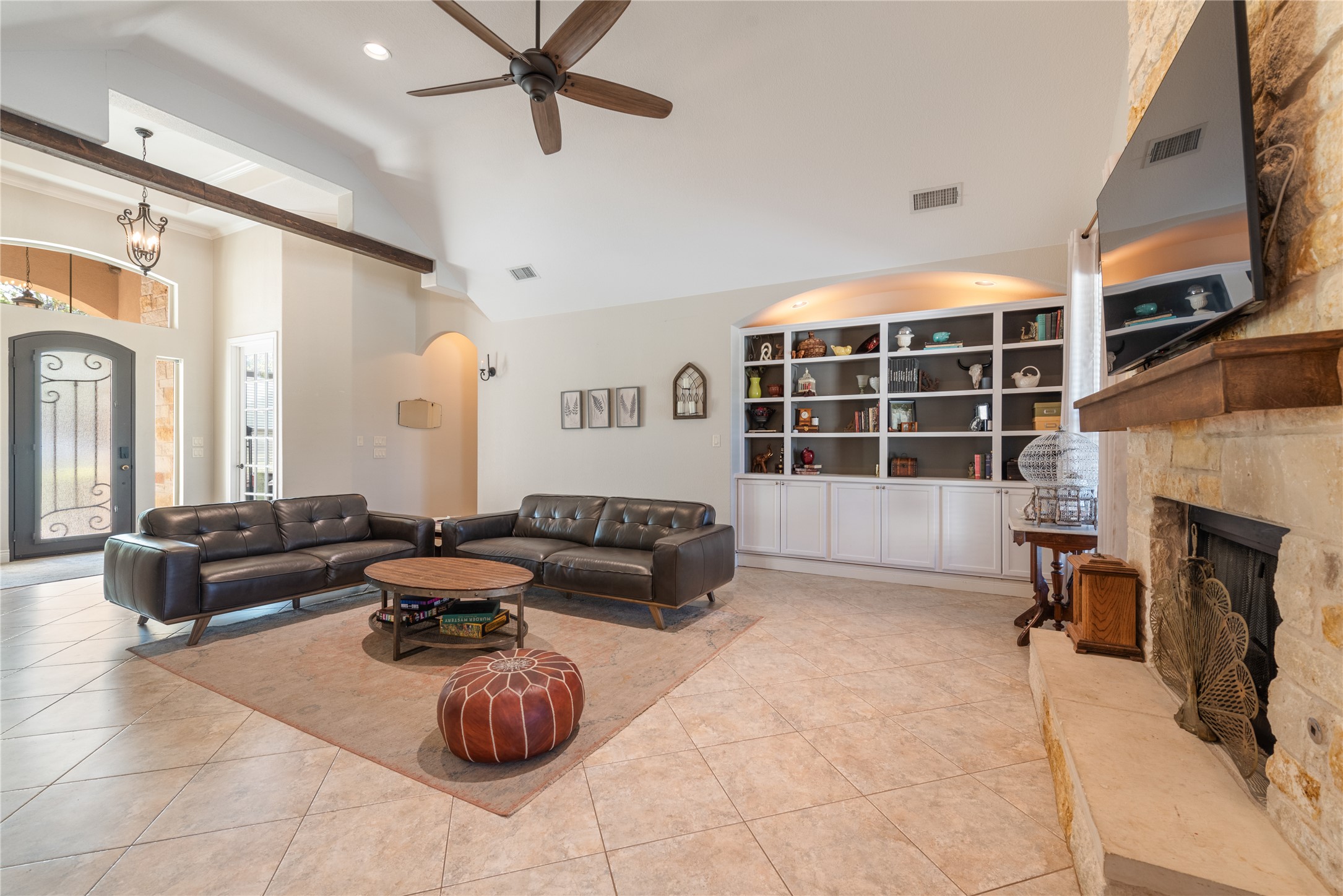 120 Layton Way Georgetown, TX 78633 - Photo 7 of 40 a living room with furniture a fireplace and a flat screen tv