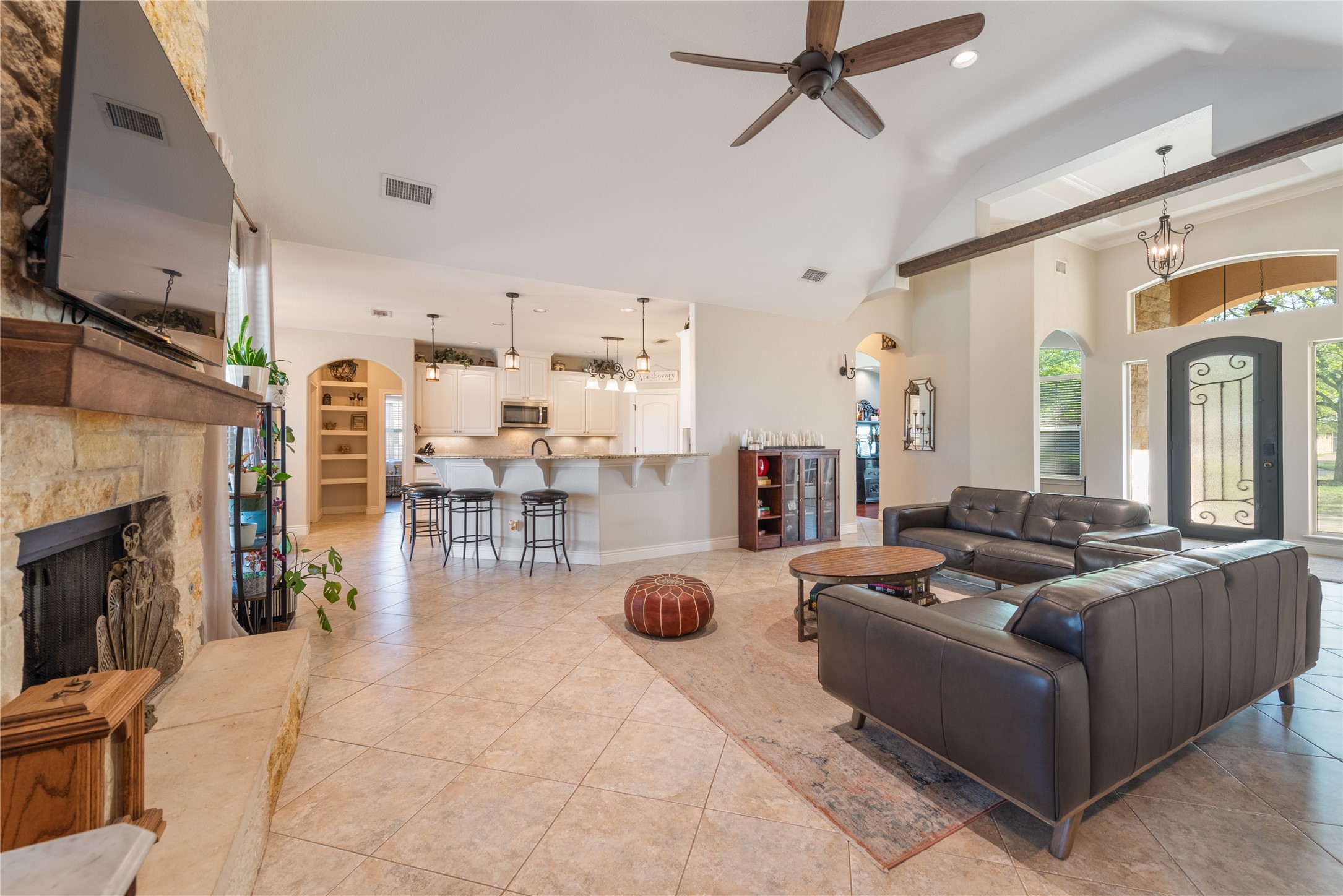 120 Layton Way Georgetown, TX 78633 - Photo 8 of 40 a living room with furniture a fireplace and a flat screen tv