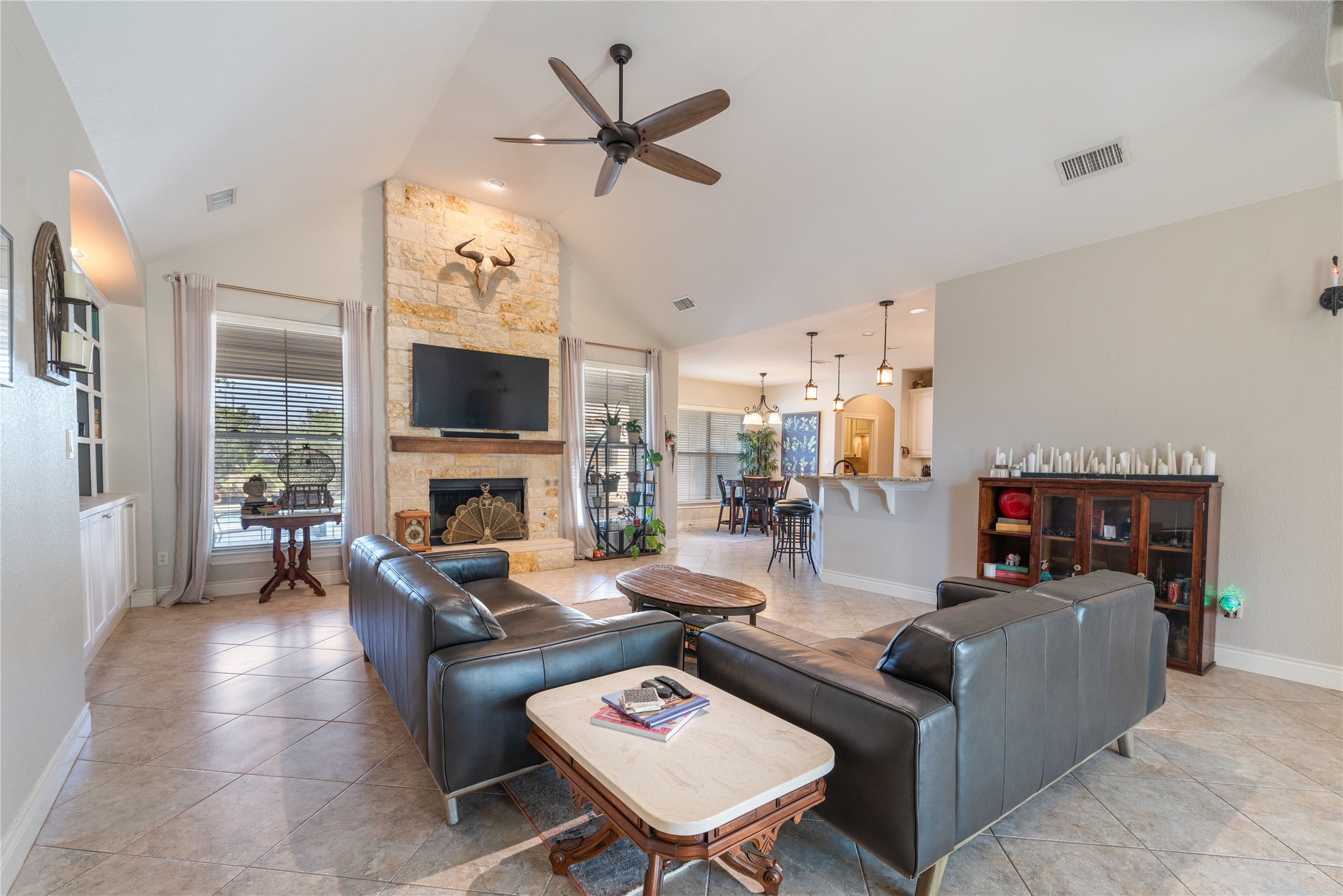 120 Layton Way Georgetown, TX 78633 - Photo 9 of 40 a living room with furniture a fireplace and a flat screen tv