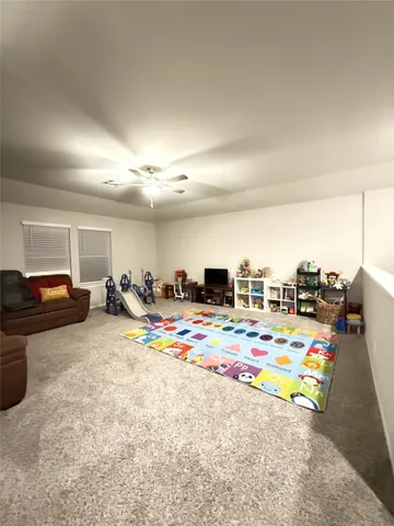 a view of a lake with a garden and patio