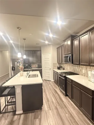 a view of a dining room with furniture and window