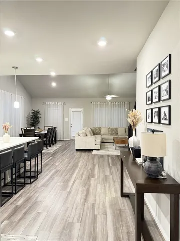 a view of kitchen with furniture and wooden floor
