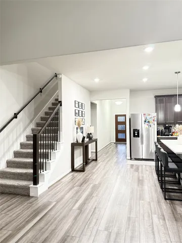 a bed room with a bed and a chandelier