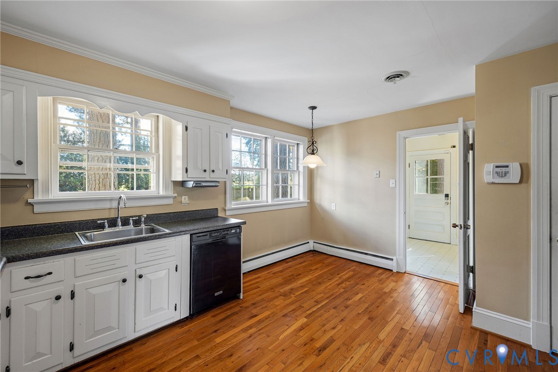 2831 Braidwood Road Richmond, VA 23225 - Photo 21 of 50 a kitchen with a sink and wooden floor