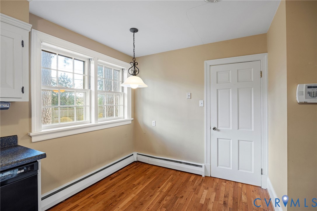 2831 Braidwood Road Richmond, VA 23225 - Photo 22 of 50 a view of an empty room with a window and wooden floor