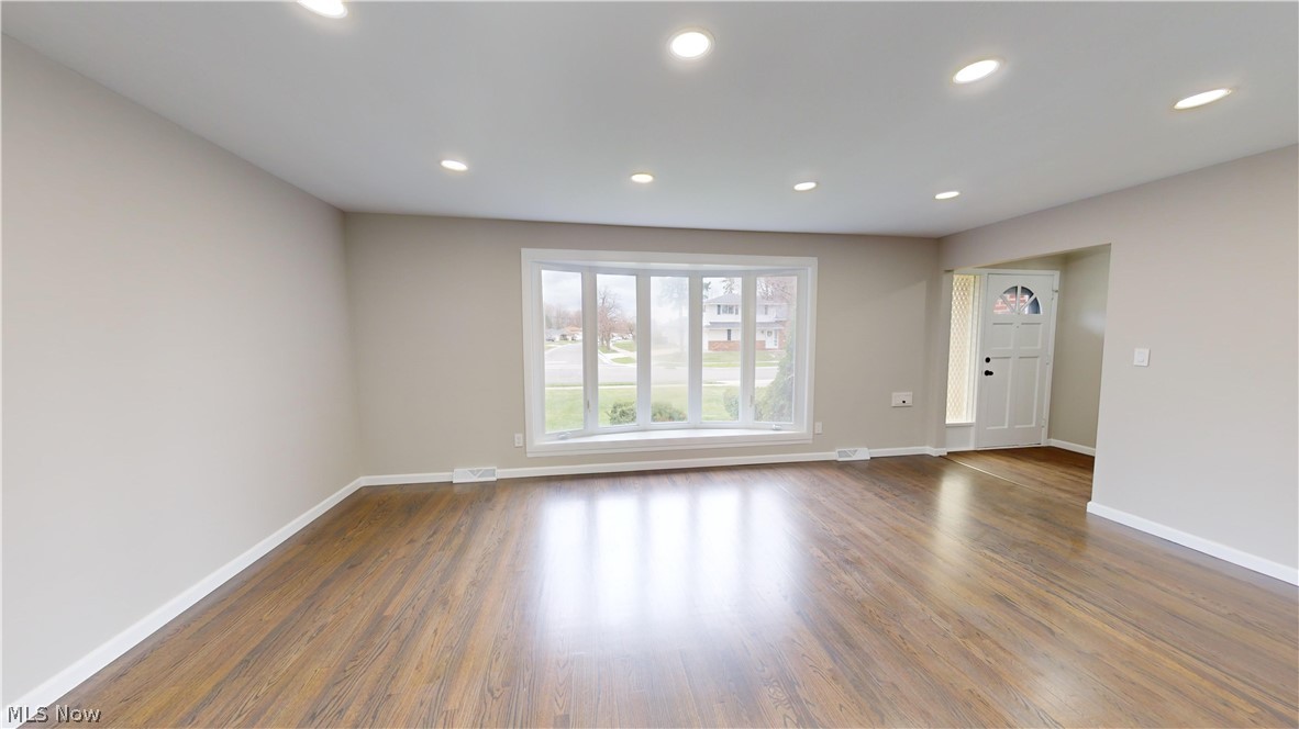 1224 Cordova Road Mayfield Heights, OH 44124 - Photo 7 of 29 Empty room with dark wood-type flooring