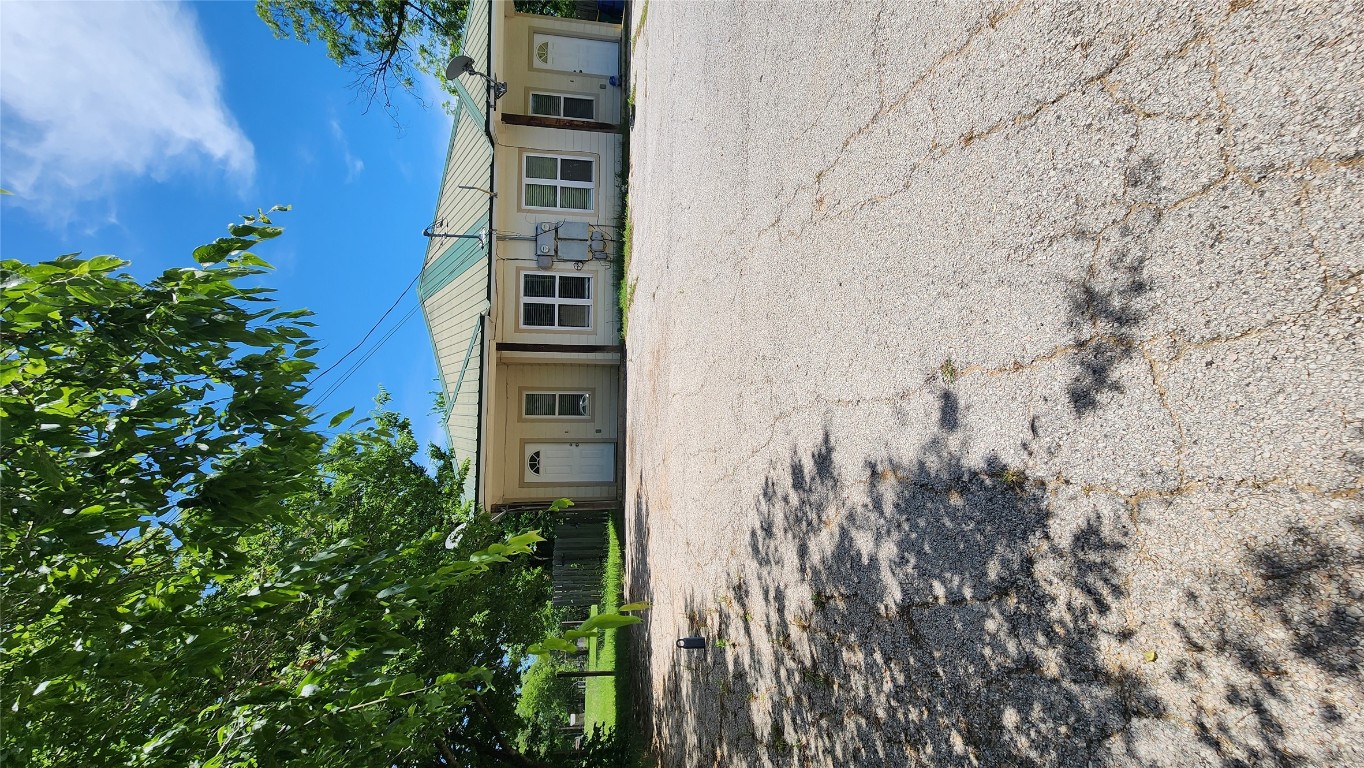 605 Martin Luther King Boulevard, Unit A Elgin, TX 78621 - Photo 18 of 18 a front view of a house with a yard