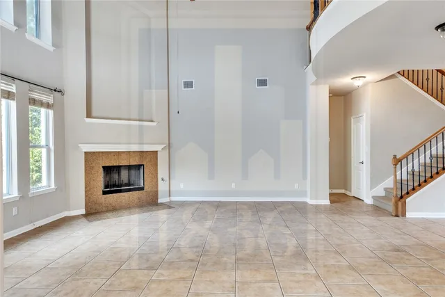 a view of a hallway with entryway and chandelier