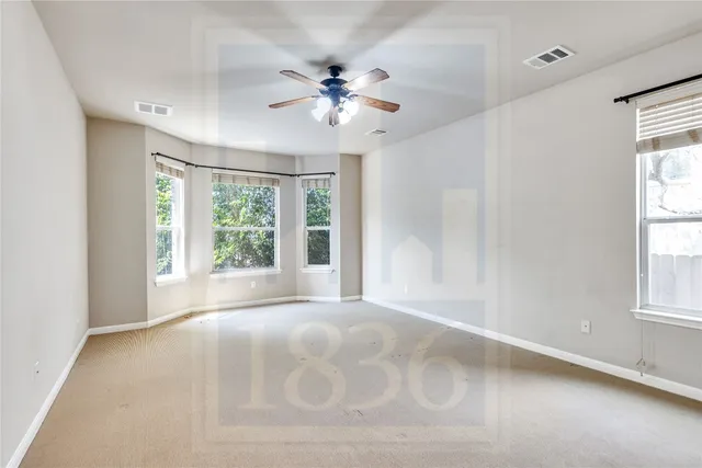 a large bathroom with a tub sink shower and mirror