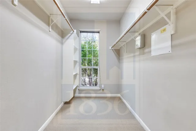 a view of a hallway with windows