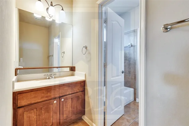 a bathroom with a double vanity sink and mirror