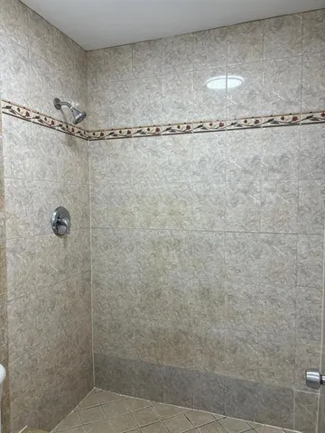 an empty room with wooden floor and closet