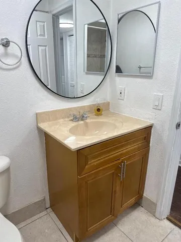 a bathroom with a shower and a bath tub