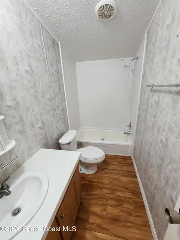 a bathroom with a sink and toilet