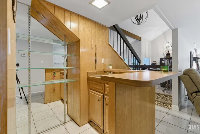 a bathroom with a sink a mirror and a shower