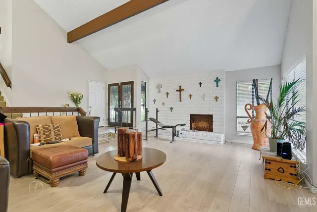 a living room with furniture and a fireplace