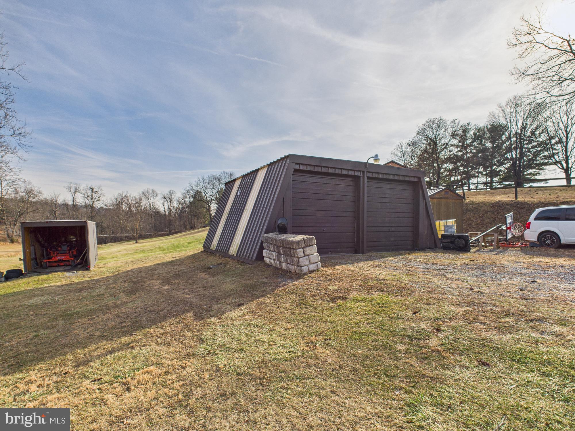 364 Bethel Grange Road Winchester, VA 22603 - Photo 13 of 52 a view of a house with a yard and garage