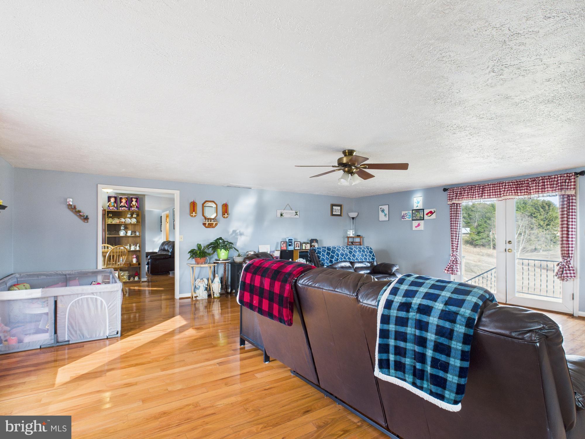 364 Bethel Grange Road Winchester, VA 22603 - Photo 26 of 52 a living room with furniture fireplace and flat screen tv