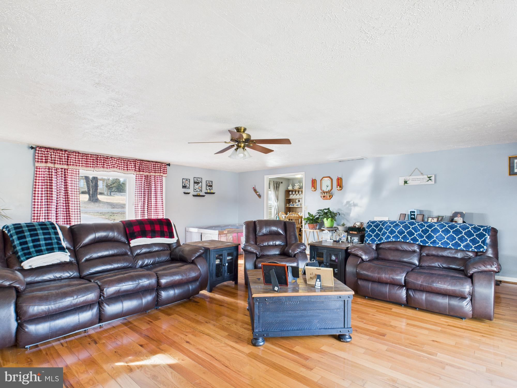 364 Bethel Grange Road Winchester, VA 22603 - Photo 27 of 52 a living room with furniture a couch and a fireplace