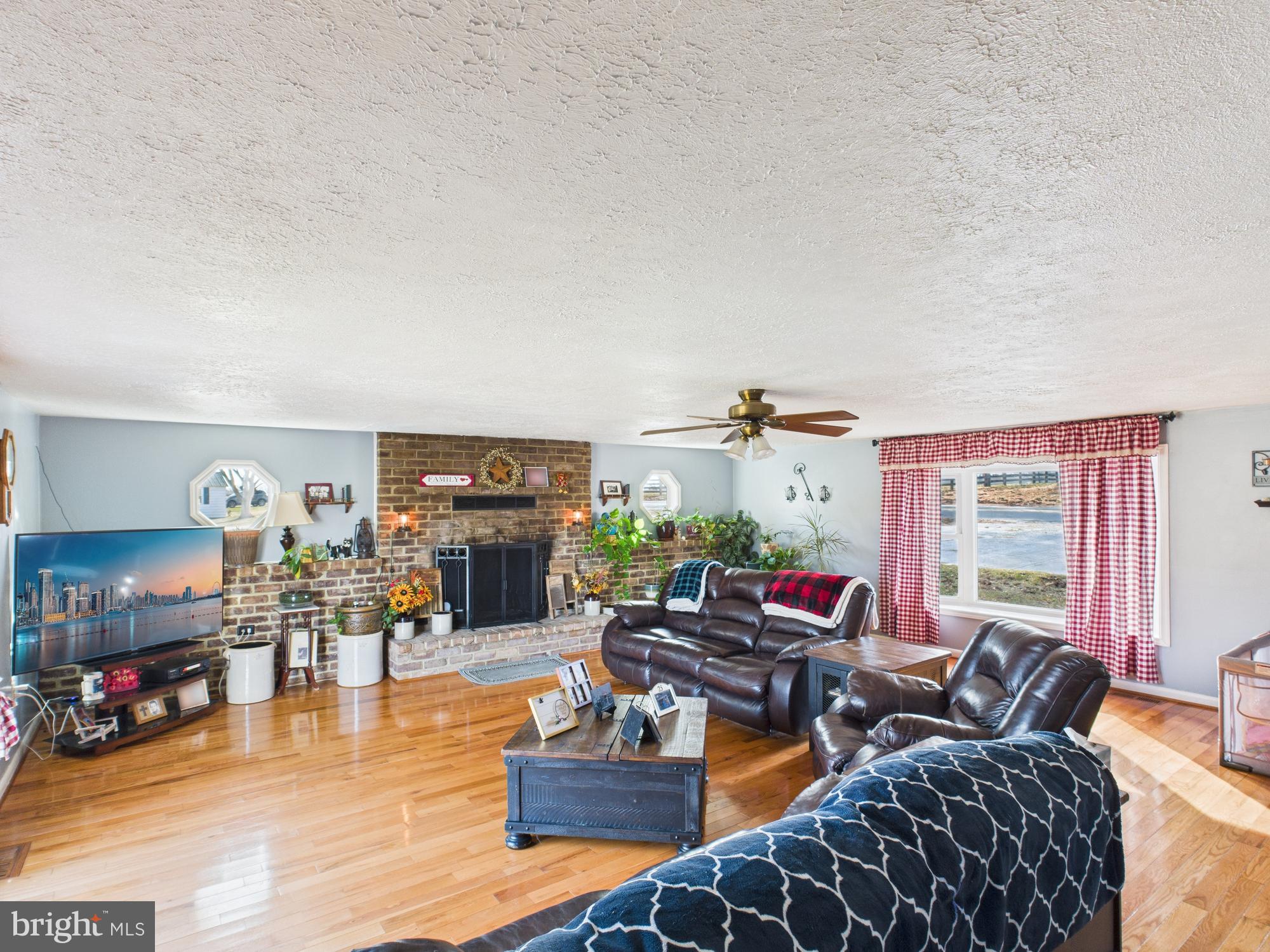 364 Bethel Grange Road Winchester, VA 22603 - Photo 28 of 52 a living room with furniture and wooden floor
