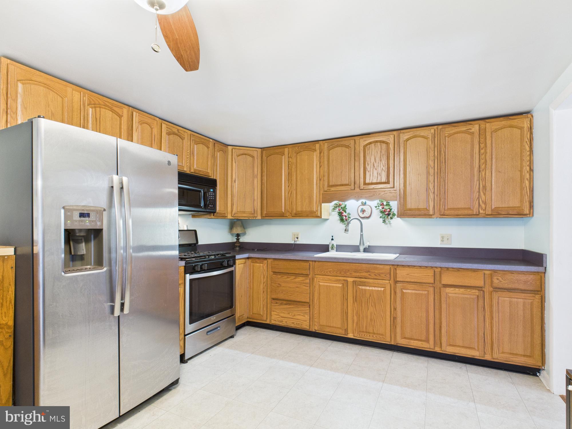364 Bethel Grange Road Winchester, VA 22603 - Photo 30 of 52 a kitchen with stainless steel appliances granite countertop a refrigerator and a stove top oven