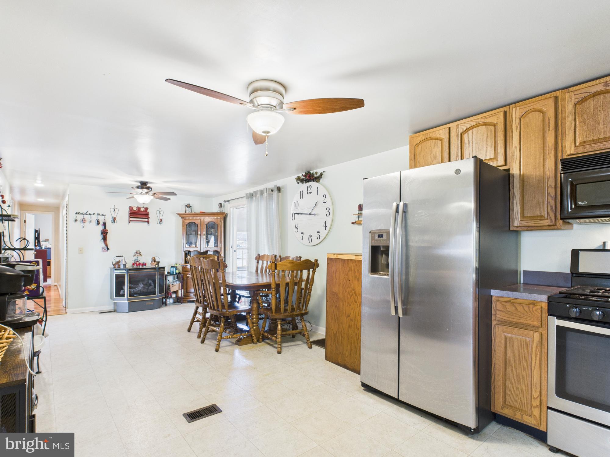 364 Bethel Grange Road Winchester, VA 22603 - Photo 32 of 52 a kitchen with stainless steel appliances a refrigerator and a stove top oven