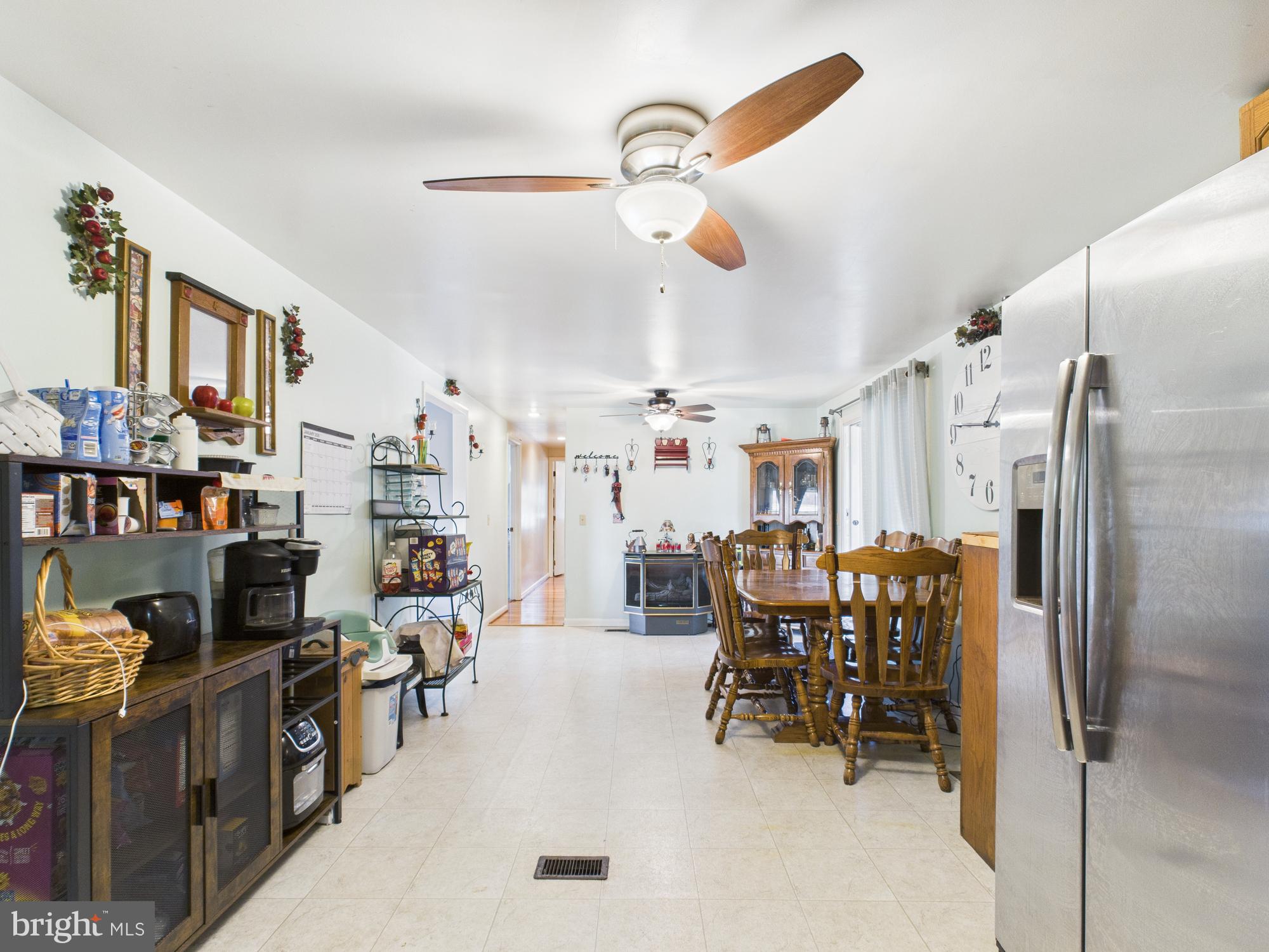 364 Bethel Grange Road Winchester, VA 22603 - Photo 33 of 52 a kitchen with stainless steel appliances kitchen island granite countertop a refrigerator and a sink