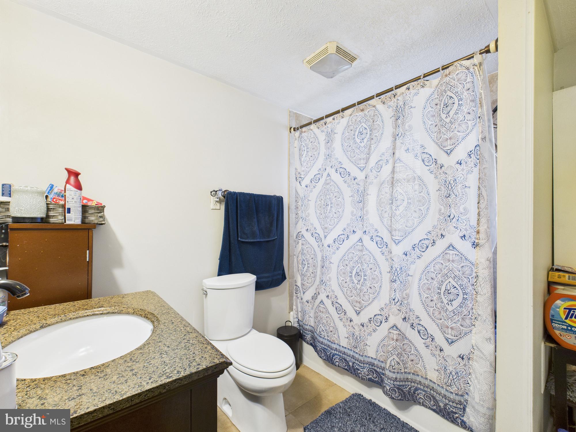 364 Bethel Grange Road Winchester, VA 22603 - Photo 39 of 52 a bathroom with a granite countertop sink and a mirror