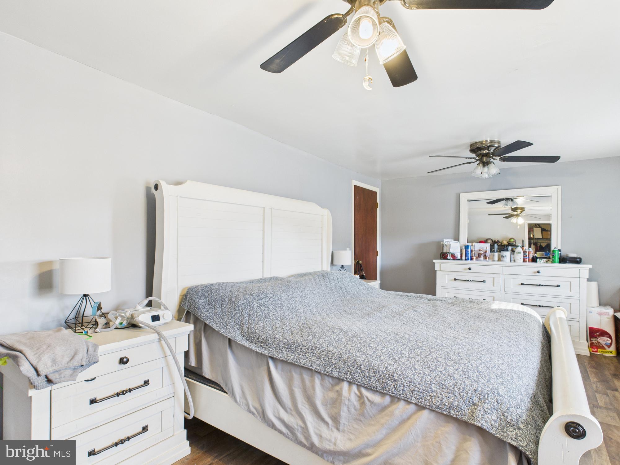 364 Bethel Grange Road Winchester, VA 22603 - Photo 43 of 52 a bedroom with a bed and cabinets