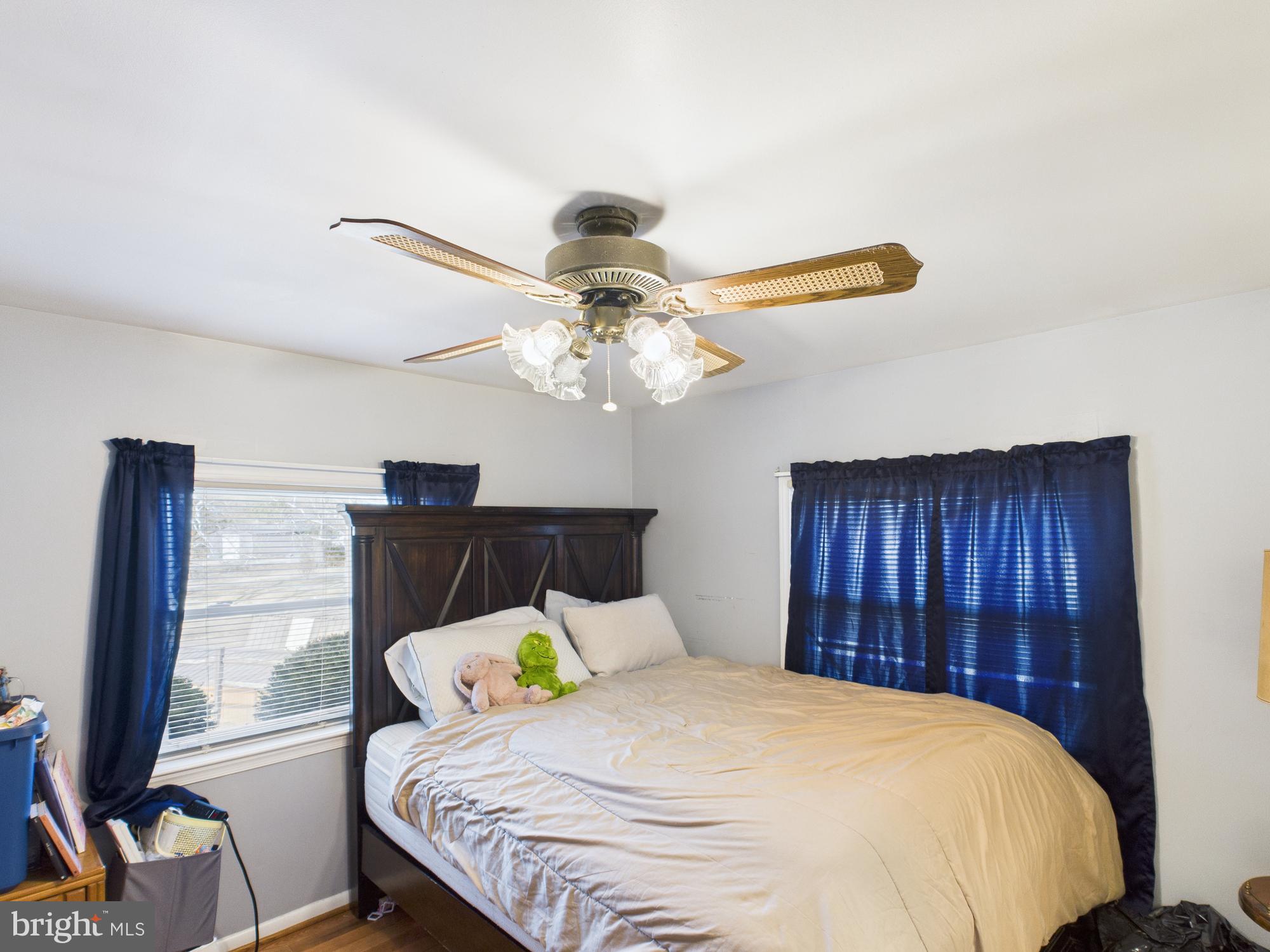 364 Bethel Grange Road Winchester, VA 22603 - Photo 44 of 52 a bedroom with a bed and a chandelier