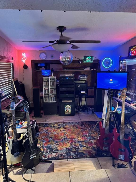 4340 Lagg Avenue Fort Myers, FL 33901 - Photo 13 of 22 a room with lots of books and chairs
