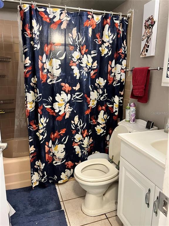 4340 Lagg Avenue Fort Myers, FL 33901 - Photo 16 of 22 a white toilet sitting next to a shower curtain