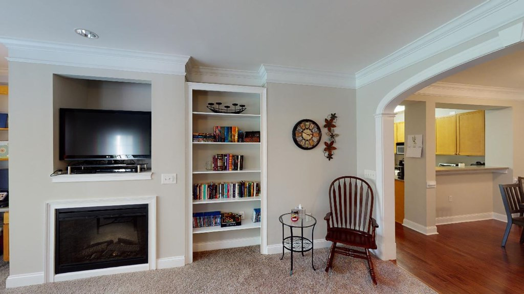 3811 Lunceston Way, Unit 105 Raleigh, NC 27613 - Photo 14 of 49 Family Room Built-in Shelving and Fireplace