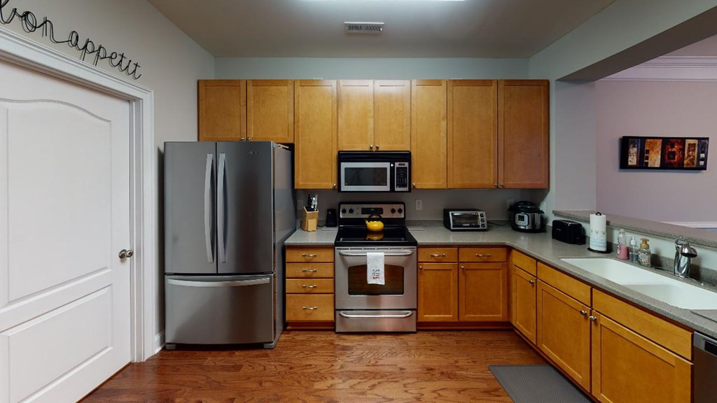 3811 Lunceston Way, Unit 105 Raleigh, NC 27613 - Photo 18 of 49 Kitchen With View of Pantry Door
