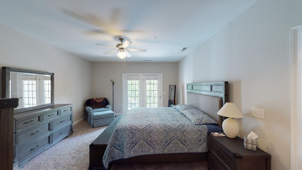 3811 Lunceston Way, Unit 105 Raleigh, NC 27613 - Photo 35 of 49 Master Bedroom With Door to Covered Balcony