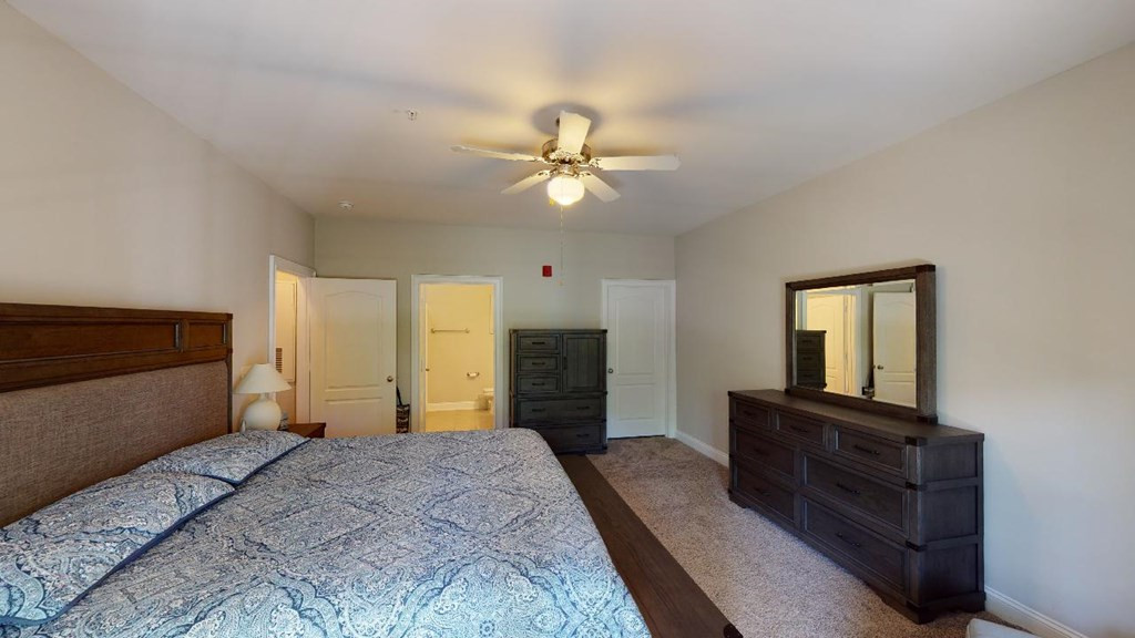 3811 Lunceston Way, Unit 105 Raleigh, NC 27613 - Photo 39 of 49 Master Bedroom With WIC Door on Right