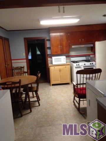 101 Nelson Street Raceland, LA 70394 - Photo 10 of 11 Foyer into kitchen