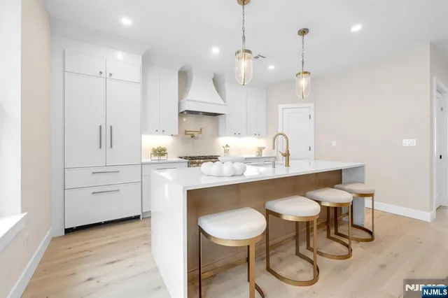 a living room with furniture and potted plants