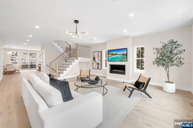 a kitchen with stainless steel appliances granite countertop a stove and cabinets