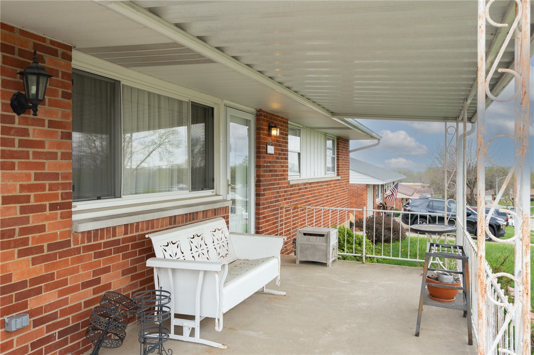 795 Spring Garden Place Dayton, OH 45431 - Photo 5 of 34 Step into comfort on this charming front porch, a perfect spot for serene mornings or peaceful evenings.