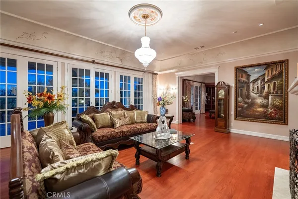 a living room with furniture fireplace and flat screen tv