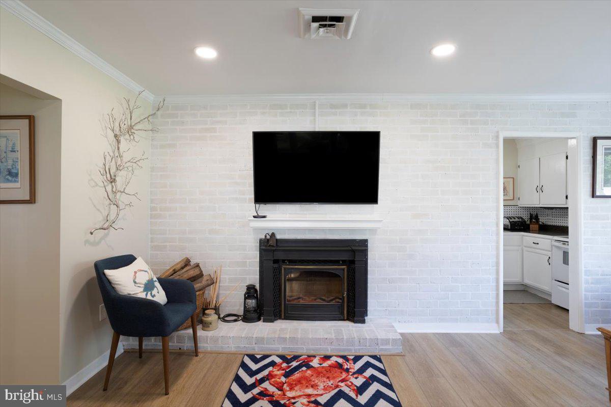 25 Algonquin Road Cambridge, MD 21613 - Photo 8 of 57 Brick hearth with wood stove insert